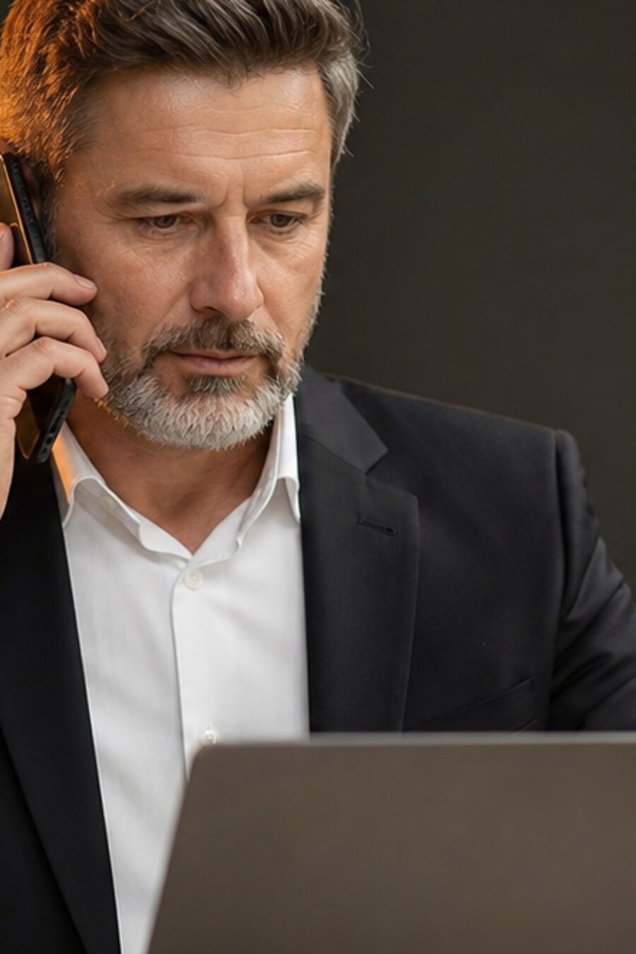 An agent on a call at a lit desk