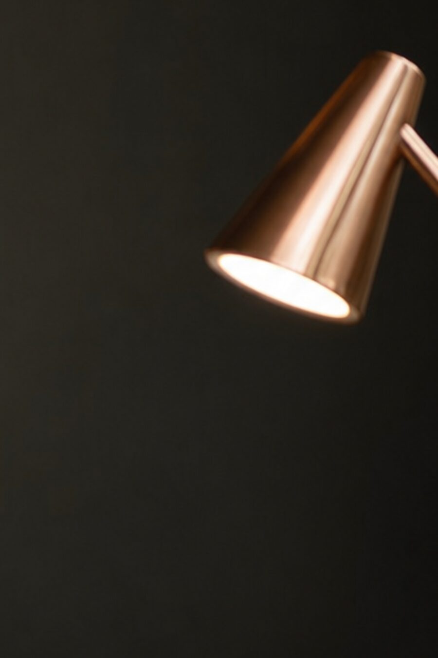 An agent working leads at a warm-lit desk